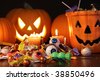 Closeup of candies with pumpkins after Halloween festivities - stock photo