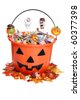 child halloween pumpkin bucket with candy and fall leaves - stock photo