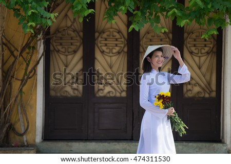 Beautiful woman with Vietnam culture traditional dress,Ao dai is
