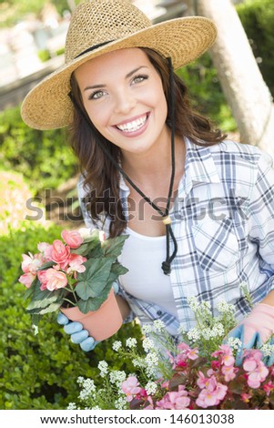 https://thumb1.shutterstock.com/display_pic_with_logo/100760/146013038/stock-photo-attractive-happy-young-adult-woman-wearing-hat-gardening-outdoors-146013038.jpg