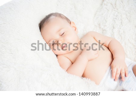 Cute baby sleeping on a blanket