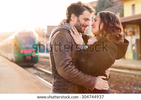 https://thumb1.shutterstock.com/display_pic_with_logo/101595/304744937/stock-photo-happy-couple-embracing-on-railway-station-platform-304744937.jpg