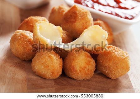 Breaded mozzarella cheese balls with tomato sauce