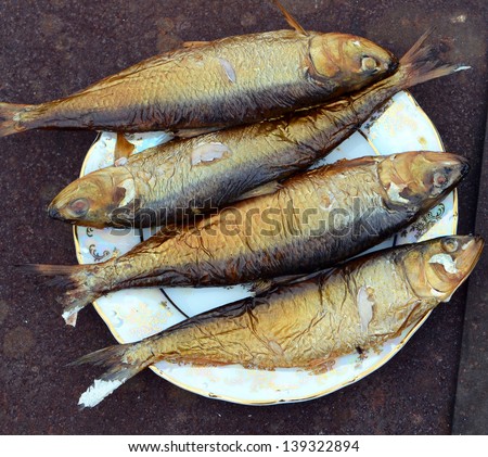 don herring golden color on a plate hot smoked fish cooked in a smokehouse