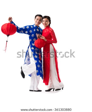 Beautiful Vietnamese couple with red paper lanterns, isolated on white