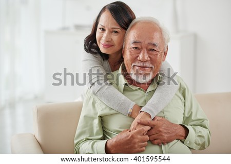 https://thumb1.shutterstock.com/display_pic_with_logo/1032538/401595544/stock-photo-happy-smiling-aged-woman-hugging-her-husband-from-behind-401595544.jpg