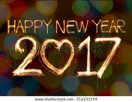 Happy new year 2017 written with Sparkling light on bokeh background