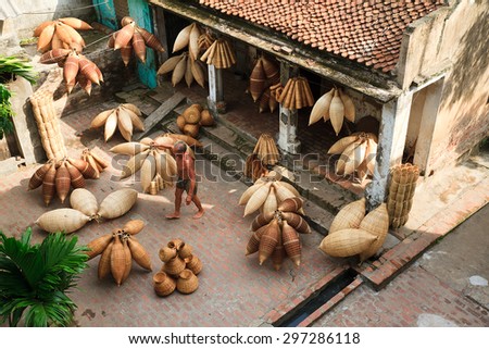HUNGYEN, VIETNAM - JUNE 21 2015 :Unidentified man was weaving bamboo in HungYen, Vietnam. Weaving this tools that used to catch fish is traditional occupation in Hung Yen province.