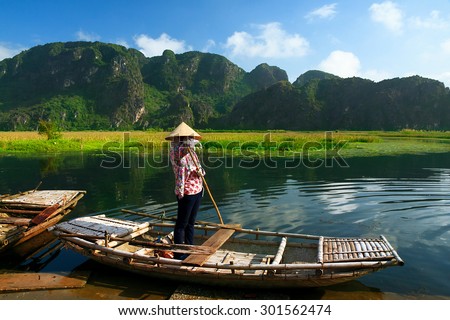Landscape with boat in Van Long natural reserve in Ninh Binh, Vietnam