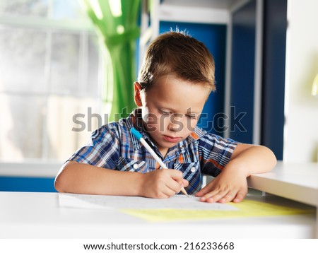 cute little boy learning alphabet