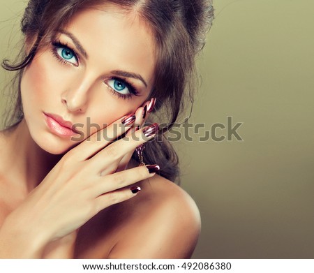 http://thumb1.shutterstock.com/display_pic_with_logo/1054231/492086380/stock-photo-beautiful-model-girl-with-pink-metallic-manicure-on-nails-fashion-makeup-and-cosmetics-492086380.jpg