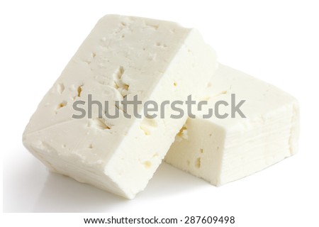 Greek feta cheese block isolated on white.