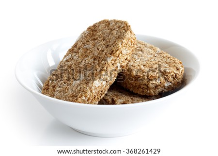 stock-photo-white-bowl-with-three-whole-wheat-breakfast-biscuits-isolated-on-white-with-no-milk-368261429.jpg