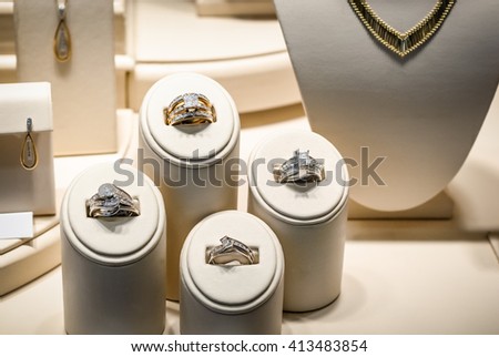 Picture Of A Jewelry Store Beige Window Display Stands With Gold Diamond Rings Necklaces Picture Of A Jewelry Store Beige Window Display Stands With Gold Diamond Rings Necklaces