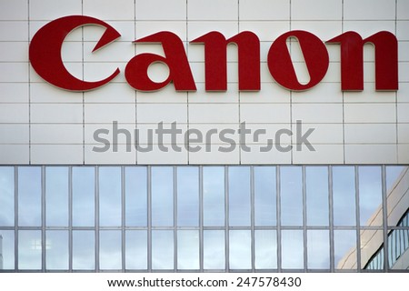 AMSTERDAM, NETHERLANDS - DECEMBER 30: The company's logo from Canon on a modern facade of an office building on December 30, 2014 in Amsterdam / Canon Amsterdam