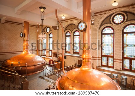 AMSTERDAM, NETHERLANDS - JUN 3, 2015: Interior of the Heineken Experience center, a historic brewery for Heineken beer. Gerard Adriaan Heineken was a founder of the Heineken beer