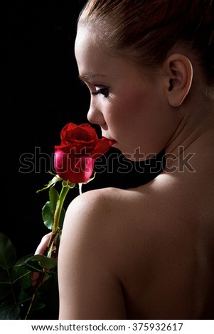 portrait of girl with <b>red rose</b> in profile on the black background - stock-photo-portrait-of-girl-with-red-rose-in-profile-on-the-black-background-375932617