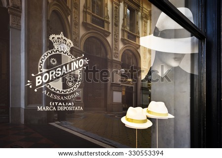 MILAN, ITALY - AUGUST 29 2015: Borsalino golden store window in galleria Vittorio Emanuele II, Milan's fashion district. August, 29 2015.