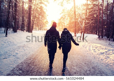 https://thumb1.shutterstock.com/display_pic_with_logo/1110263/561024484/stock-photo-couple-holding-hands-walking-away-winter-sunny-forrest-recreation-leisure-clothing-561024484.jpg