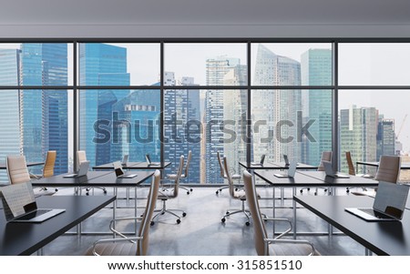 Workplaces in a modern panoramic office singapore city view from the windows open space Workplaces in a modern panoramic office singapore city view from the windows open space