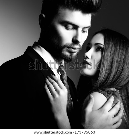 https://thumb1.shutterstock.com/display_pic_with_logo/111616/173795063/stock-photo-portrait-of-beautiful-young-man-and-woman-dressed-in-classic-clothes-studio-shot-over-grey-173795063.jpg