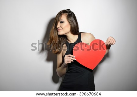 https://thumb1.shutterstock.com/display_pic_with_logo/111616/390670684/stock-photo-heartbreaker-temptress-seductive-woman-portrait-of-amazing-young-fashion-woman-posing-at-studio-390670684.jpg
