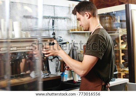 young guy barista works coffee shop stock photo 773016556 shutterstock barista works