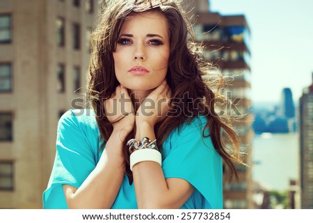 https://thumb1.shutterstock.com/display_pic_with_logo/1125836/257732854/stock-photo-beautiful-brunette-woman-wearing-loose-dress-sitting-on-the-rooftop-city-view-257732854.jpg