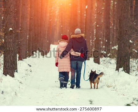https://thumb1.shutterstock.com/display_pic_with_logo/1128848/275600897/stock-photo-young-couple-in-love-with-dog-walking-in-the-snowy-forest-back-to-camera-275600897.jpg
