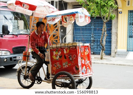 CAN THO, VIETNAM - NOVEMBER 7: Unidentified street ice cream vendor waits his customers on a street in Can Tho, Vietnam, November 7, 2008. Using of tricycles is common for street vendors in Vietnam.