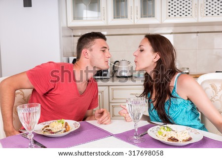 http://thumb1.shutterstock.com/display_pic_with_logo/1157519/317698058/stock-photo-young-couple-having-romantic-dinner-together-at-home-man-and-woman-sharing-single-spaghetti-317698058.jpg