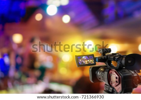 Video camera taking video streaming at event background