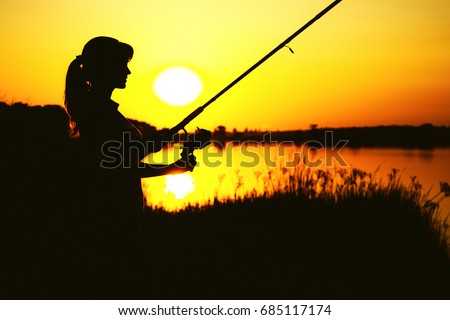 https://thumb1.shutterstock.com/display_pic_with_logo/1174673/685117174/stock-photo-silhouette-of-a-young-woman-with-a-fishing-rod-on-the-river-bank-in-the-reeds-resting-on-the-nature-685117174.jpg