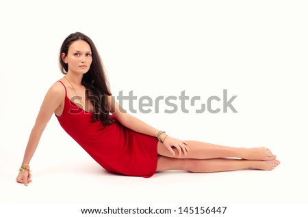 https://thumb1.shutterstock.com/display_pic_with_logo/1179395/145156447/stock-photo-beautiful-brunette-woman-in-red-dress-posing-fashion-in-studio-woman-lying-down-145156447.jpg