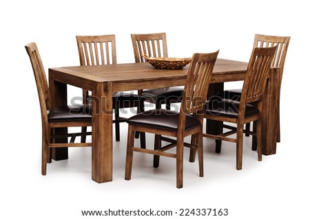 Wooden brown table and six chairs shot on white background