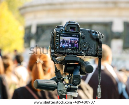 PARIS, FRANCE - OCTOBER 3, 2015: Canon camera shooting Zombie parade taking place at Place de la Republique. Zombie Walk is an annual event in Paris.