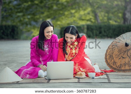 Asian student woman, Ao dai is famous traditional costume for woman in Vietnam