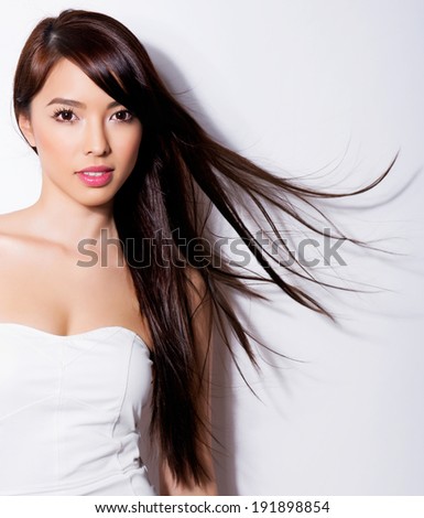 https://thumb1.shutterstock.com/display_pic_with_logo/122137/191898854/stock-photo-beautiful-asian-woman-with-long-hair-posing-on-grey-background-191898854.jpg