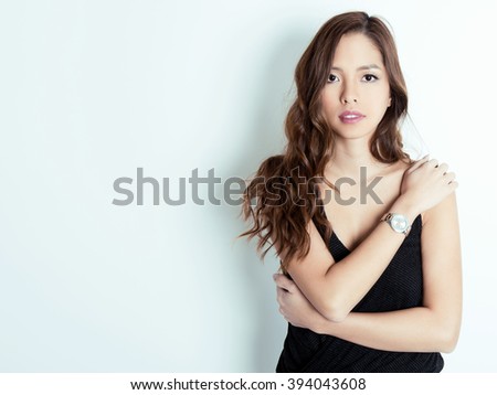 https://thumb1.shutterstock.com/display_pic_with_logo/122137/394043608/stock-photo-beautiful-young-asian-woman-with-long-hair-wearing-a-wrist-watch-394043608.jpg