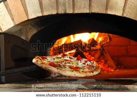 And burning pizza wood fireplace oven