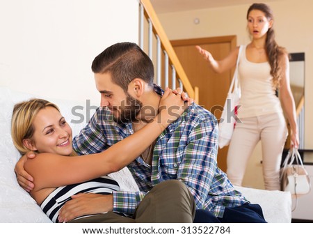 https://thumb1.shutterstock.com/display_pic_with_logo/124564/313522784/stock-photo-love-triangle-happy-husband-despair-wife-and-lover-at-home-interior-313522784.jpg