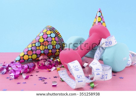 New Year Exercise Resolution with dumbbells and party decorations on white and blue background.