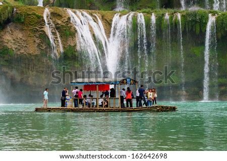 CAOBANG, VIETNAM, NOVEMBER 10: Tourist visit Ban Gioc waterfall by boat on November 10, 2013 in Caobang, Vietnam. Ban Gioc waterfall is along Vietnamese and Chinese board.