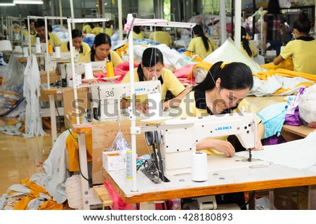 HANOI, VIETNAM - JUNE, 10, 2013: Workers work in a garment factory.