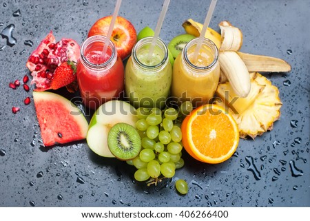 Fresh Juices Smoothie Red Green Yellow Tropical Fruits Water Melon Strawberry Apple Kiwi Orange Mango Banana Pine Apple Pomegranate Grape Selective focus Bottles multi-colour