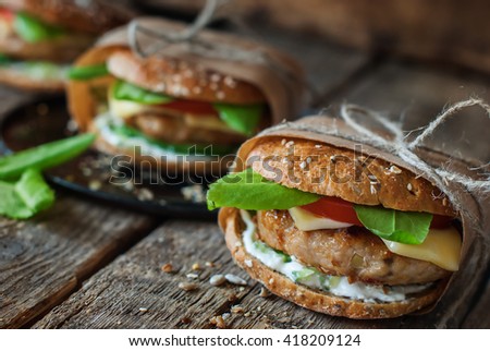 Homemade Traditional Hamburgers Pork Cheese Vegetables Wooden Wrapped Up Paper Textured Background Healthy Unhealthy Concept Homemade Traditional Hamburgers Pork Cheese Vegetables Wooden Wrapped Up Paper Textured Background Healthy Unhealthy Concept
