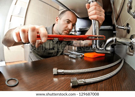 portrait of caucasian plumber at work