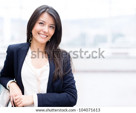 Successful business woman looking confident and smiling