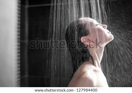 Attractive Mixed Asian Female side view enjoying shower