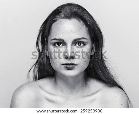 https://thumb1.shutterstock.com/display_pic_with_logo/1306012/259253900/stock-photo-woman-face-freckled-young-beautiful-healthy-skin-and-long-hair-portrait-black-and-white-259253900.jpg